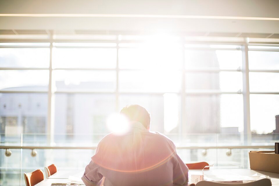 A person reading at an office desk